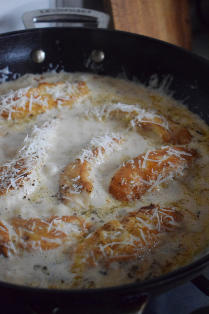 Chicken tenders in a creamy parmesan sauce.
