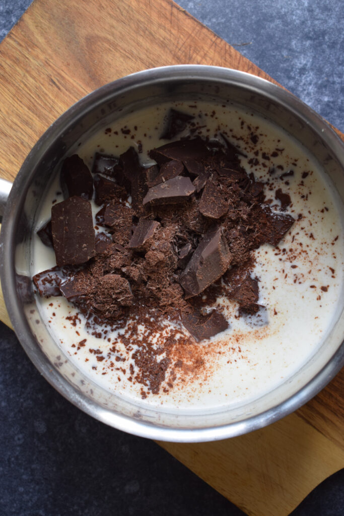Adding chocolate to cream to make ganache.