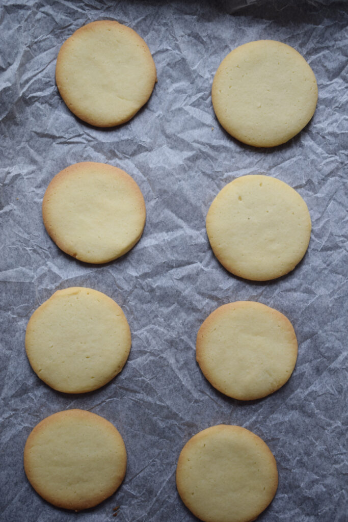 Baked shortbread cookies on a baking tray.