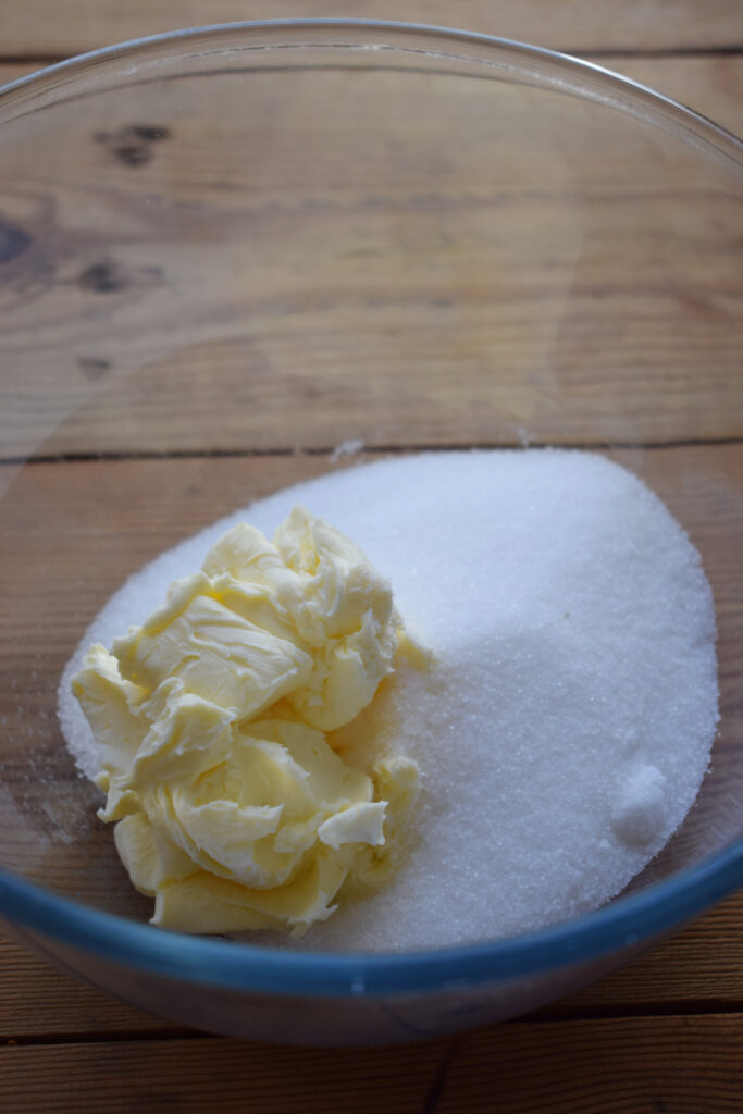 Sugar and butter in a glass bowl.