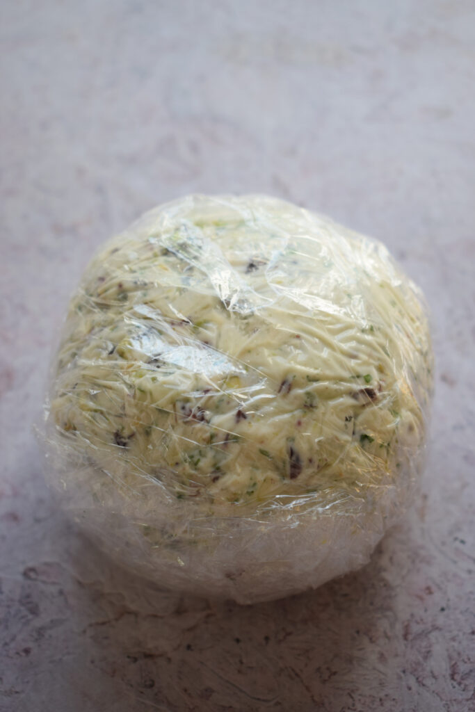 Cheese ball in plastic wrap.