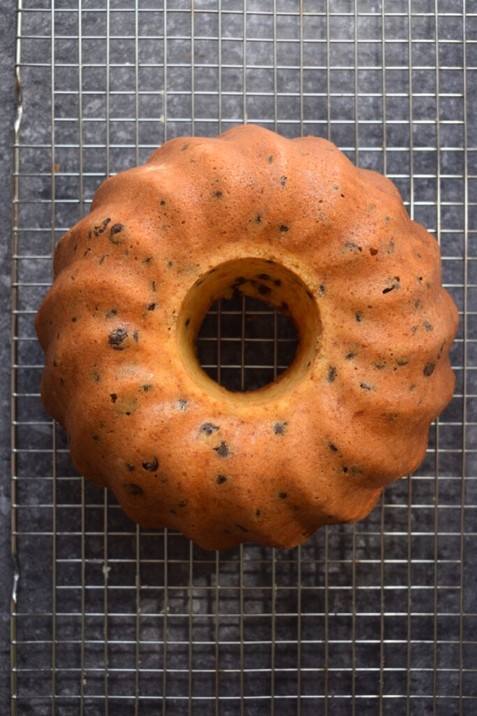 Chocolate chip bundt cake on a cooling rack.
