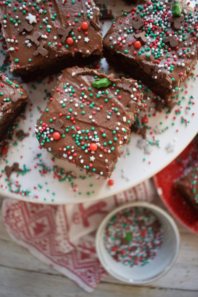 Frosted brownies with Christmas sprinkles.