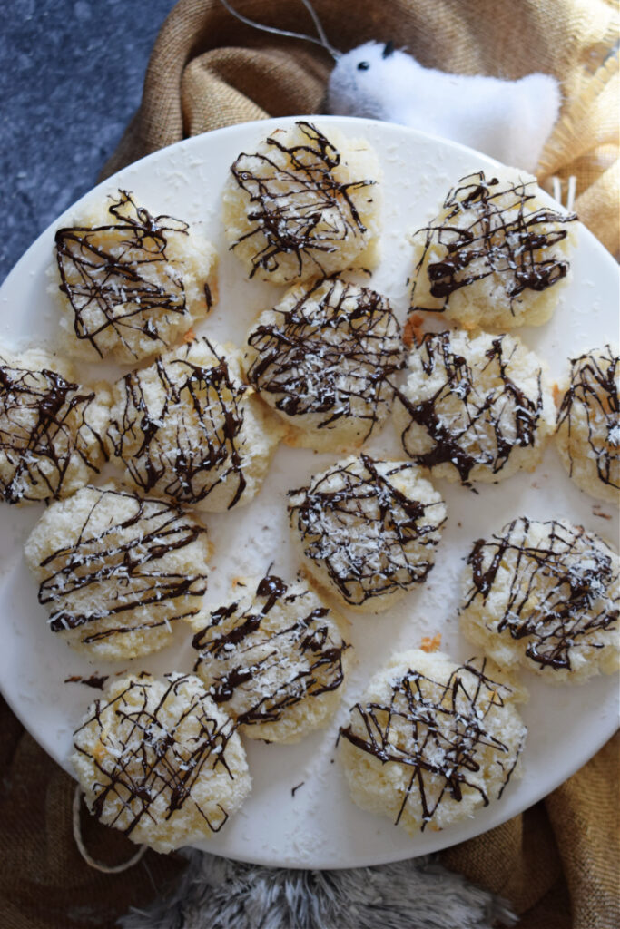 Coconut macaroons on a white plate.