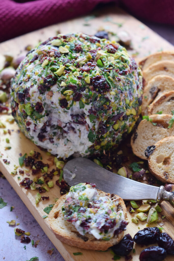 Goat cheese ball with crackers.