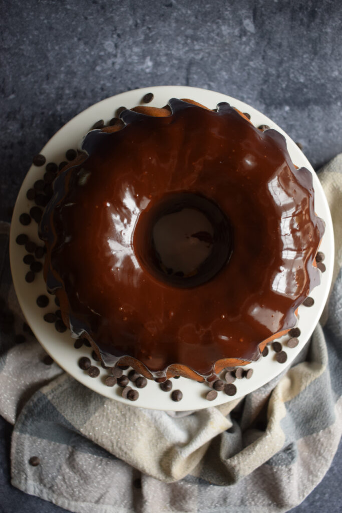 Over head view of a chocolate chip bundt cake with chocolate ganache.