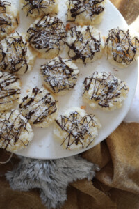 Coconut macaroons on a white serving dish.