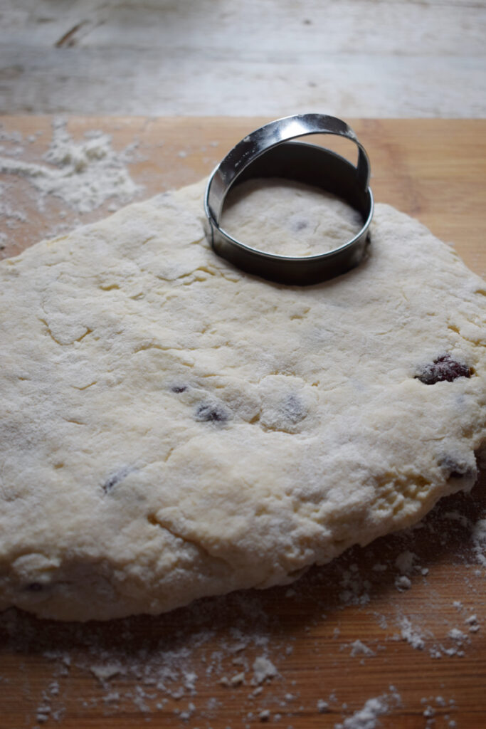 Cutting out cranberry scones.
