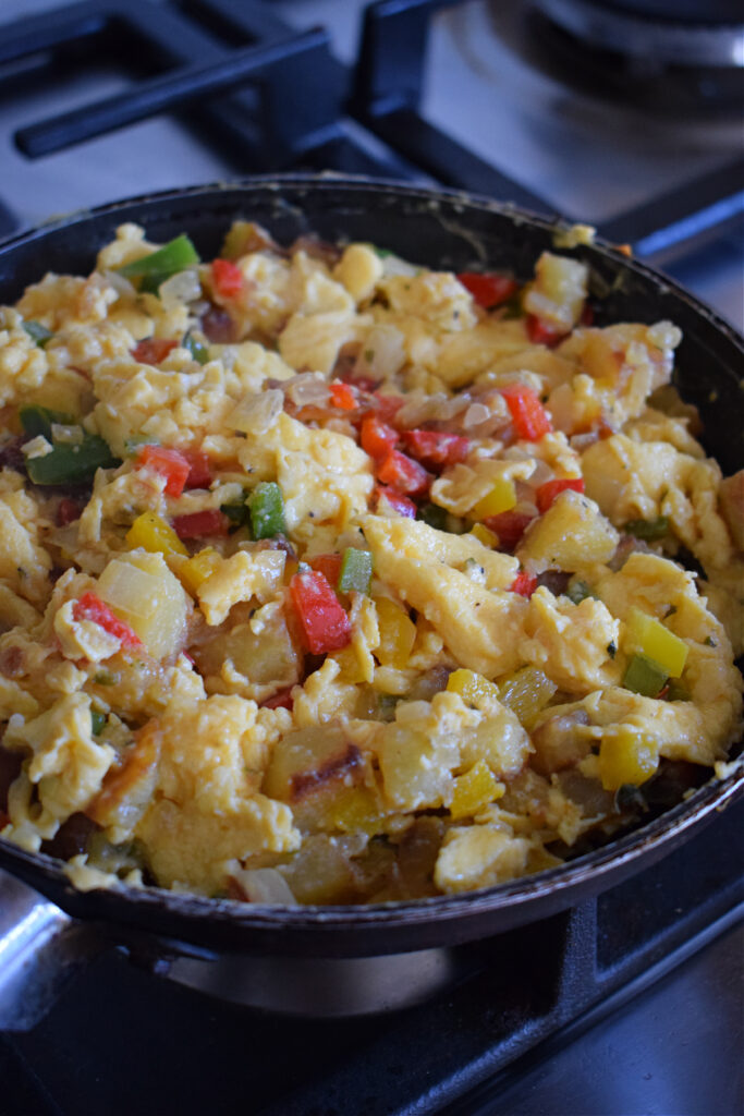 Vegetables and eggs in a skillet.