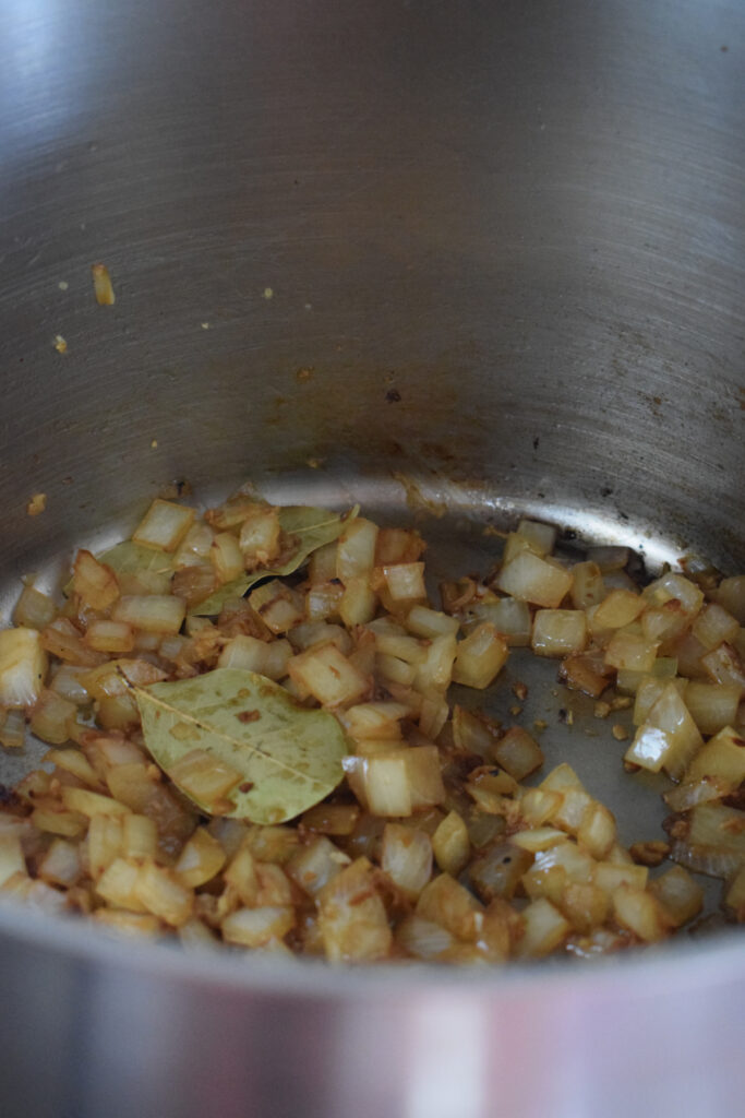Cooked onions in a pot.