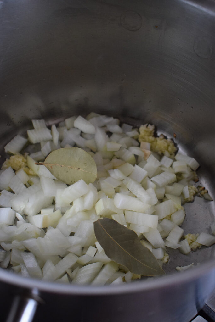 Cooking onions in a large pot.