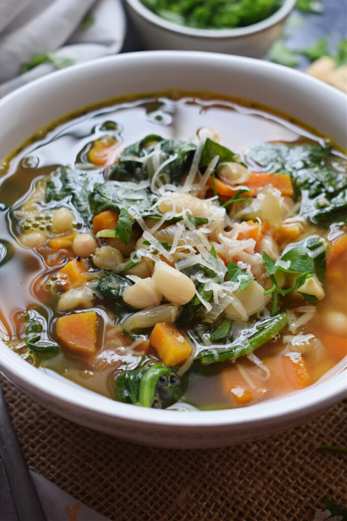Bean & spinach soup in a white bowl.