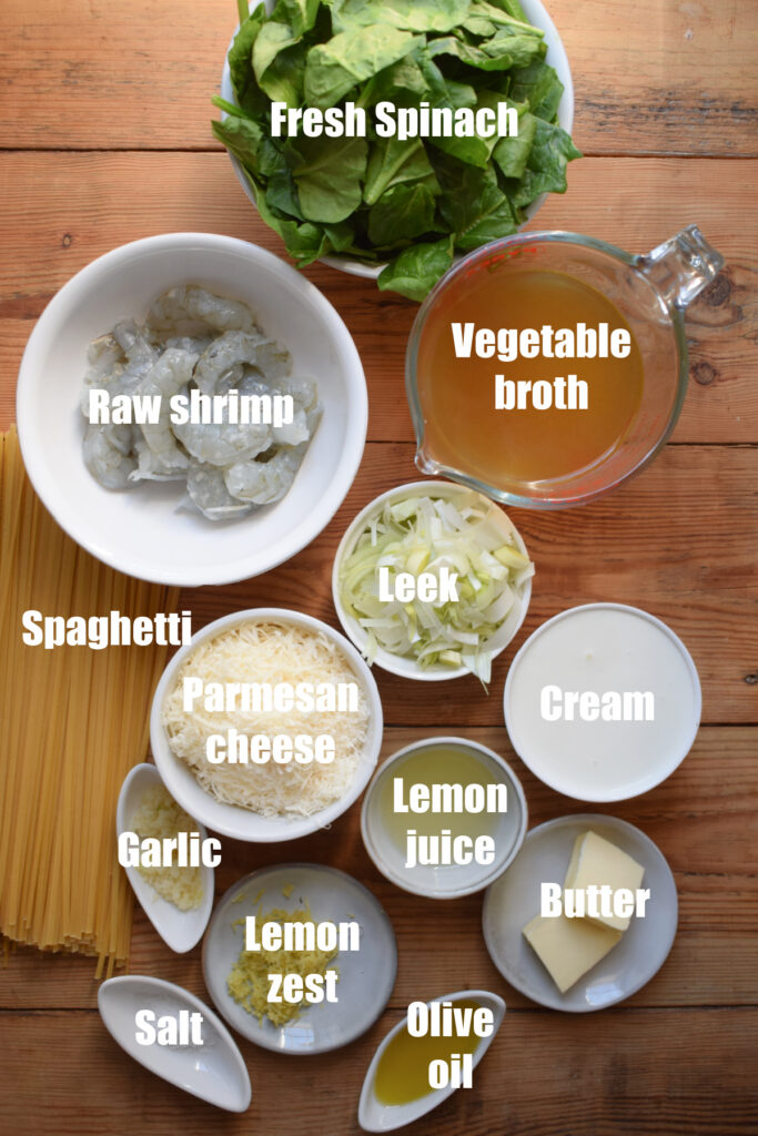 Ingredients to make creamy shrimp pasta with spinach.