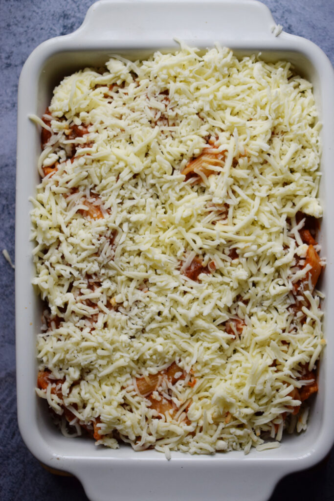 Pasta dish topped with mozzarella cheese.