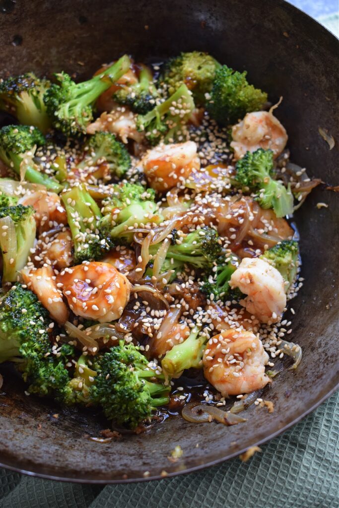 Shrimp and Broccoli Stir Fry in a wok.