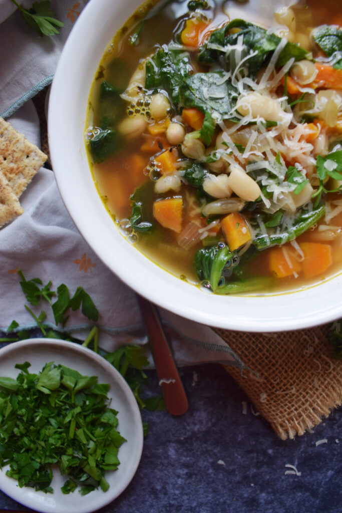 Spinach and vegetable soup in a bowl.