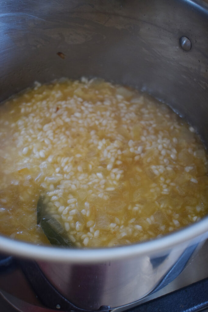 Making risotto in a saucepan.