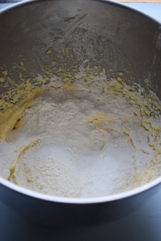 Flour in a bowl with butter and sugar.