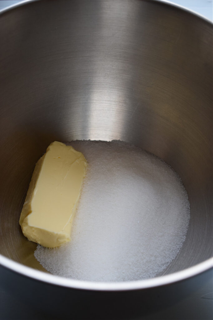 Butter and sugar in a large mixing bowl.