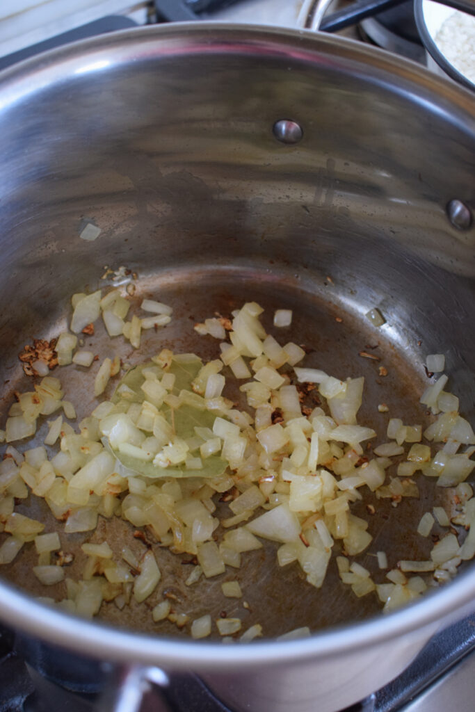 Cooked onions in a saucepan.