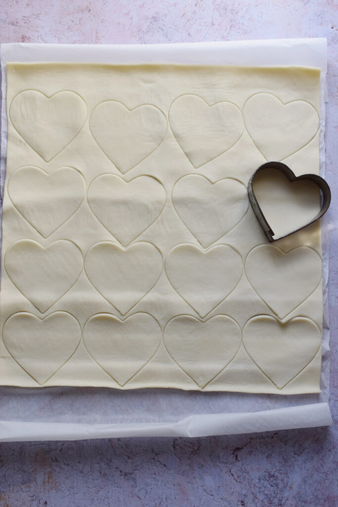 Hearts cut out of pastry.