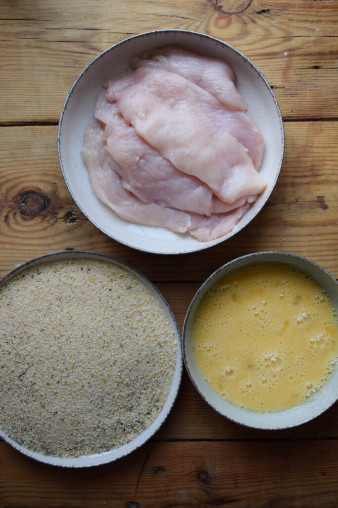Ingredients ready to coat fried chicken.