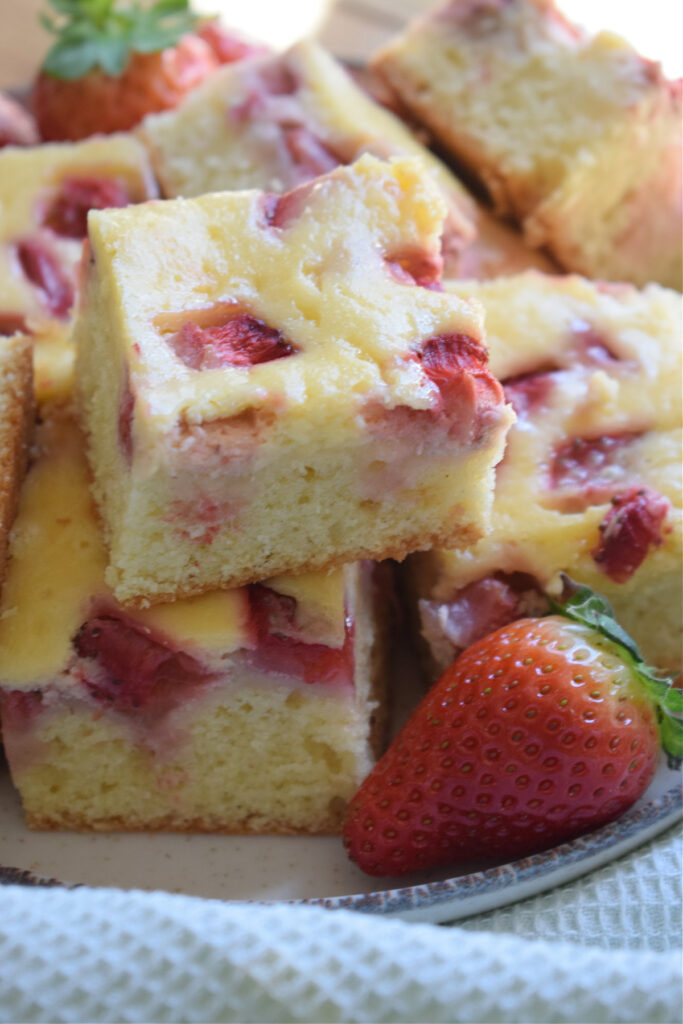 Close up of strawberry cake squares.