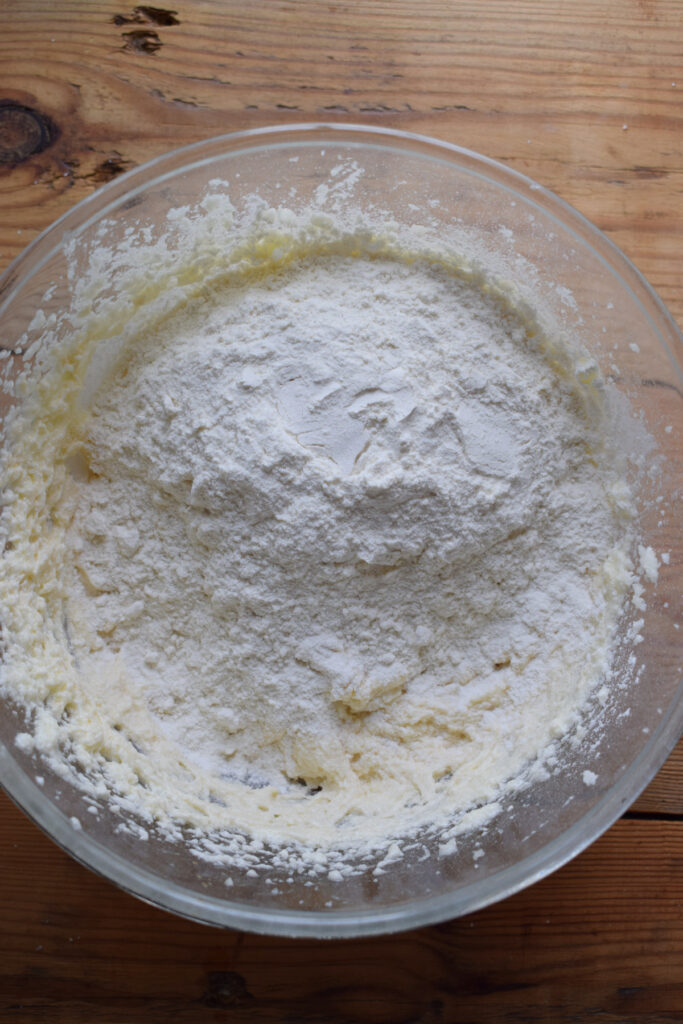 Add sifted flour to cake batter.