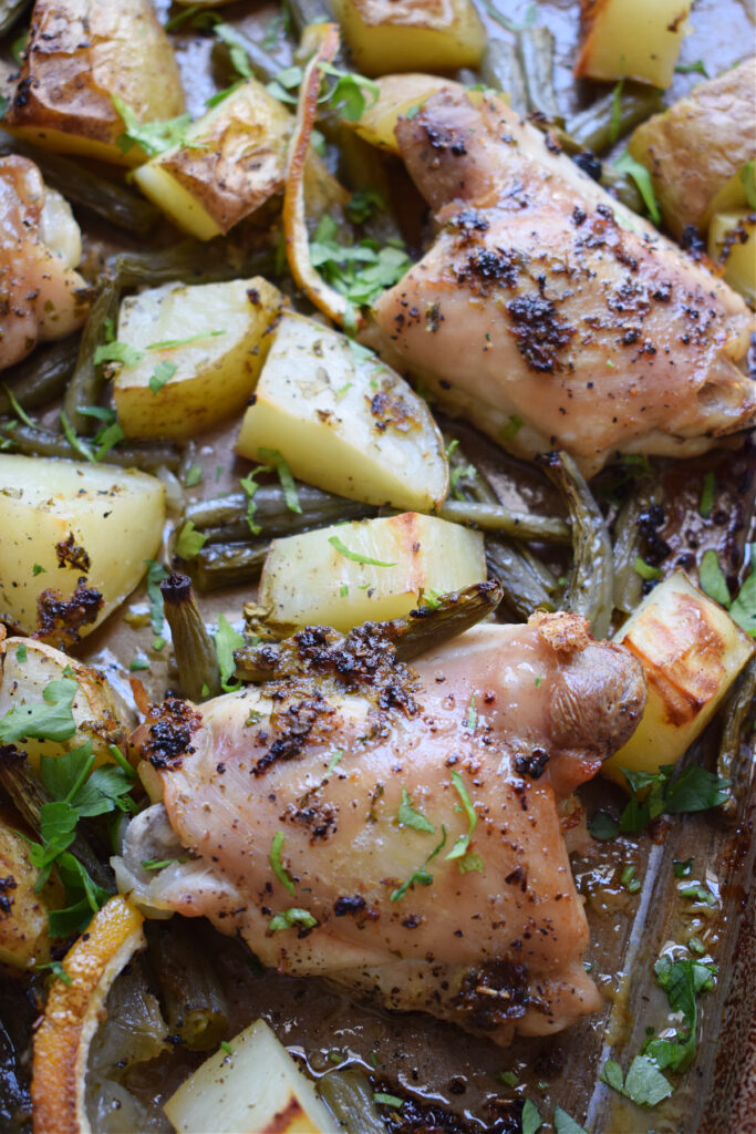 Lemon herb chicken in a sheet pan.