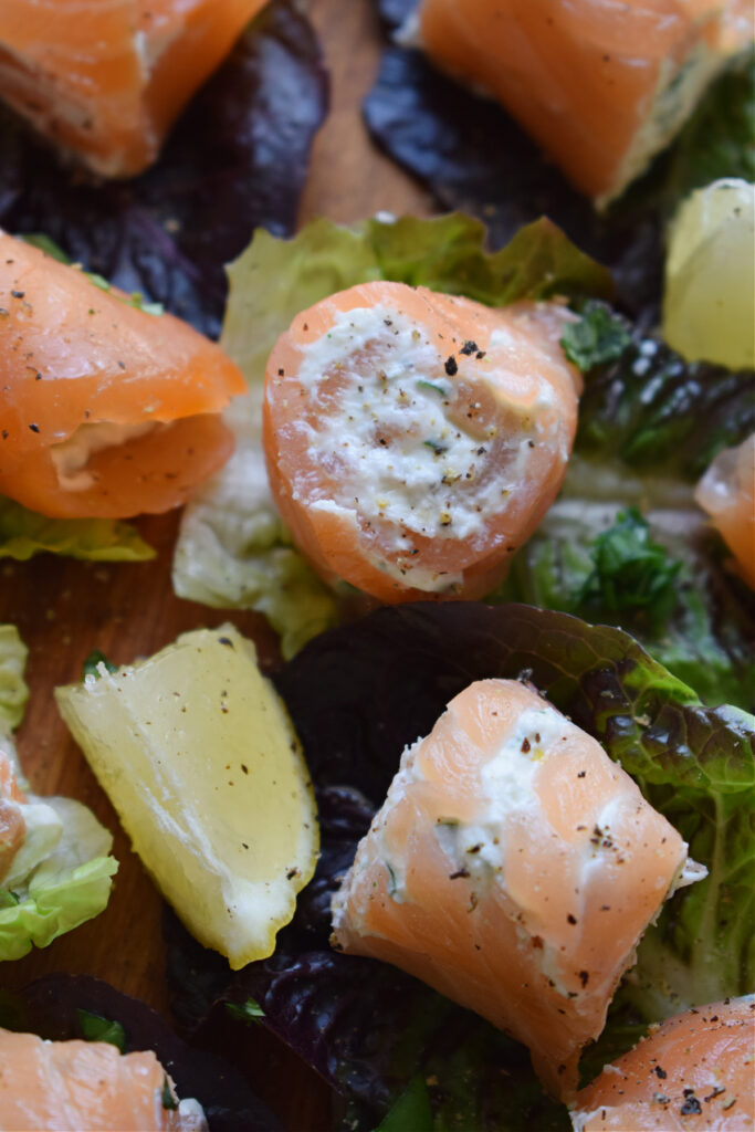 Close up of smoked salmon rolls with cream cheese.