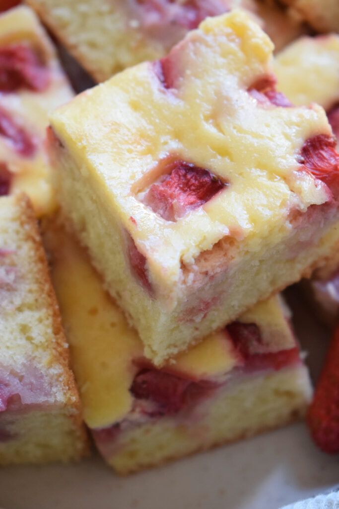 Close up of strawberry cream cheese cake squares.