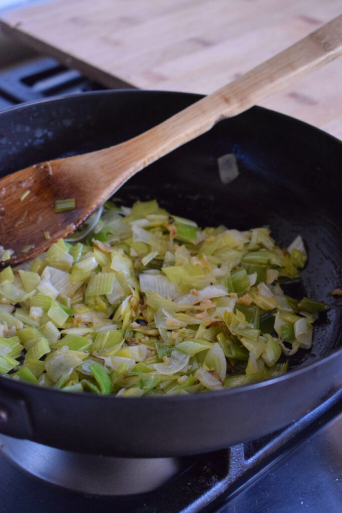 Cooked leeks in a skillet.