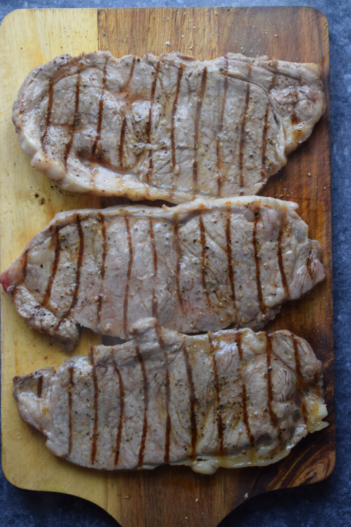 Steak on a cutting board.