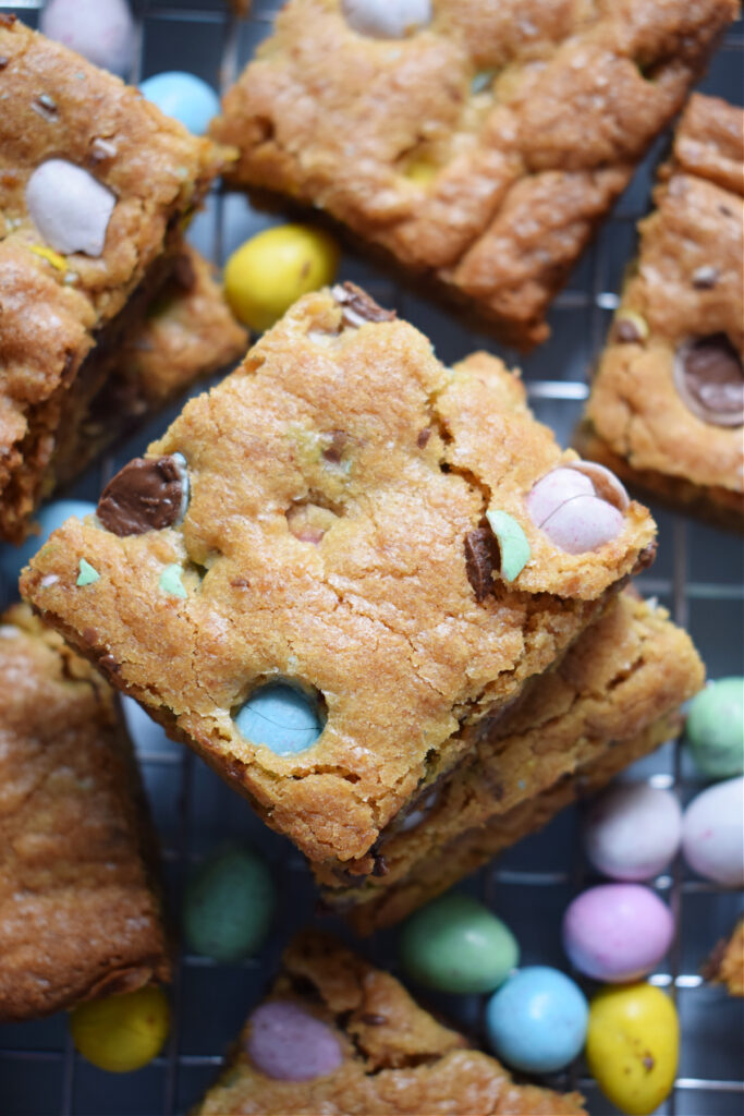 Close up of mini egg cookie bars and candy.