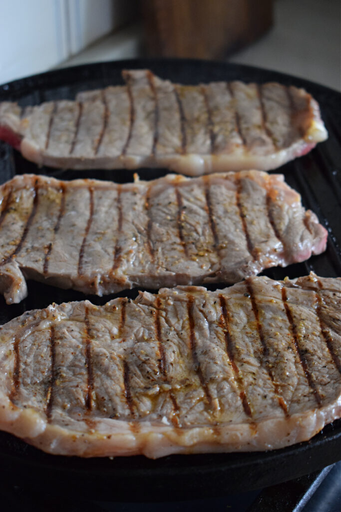 Cooking steak in cast iron.