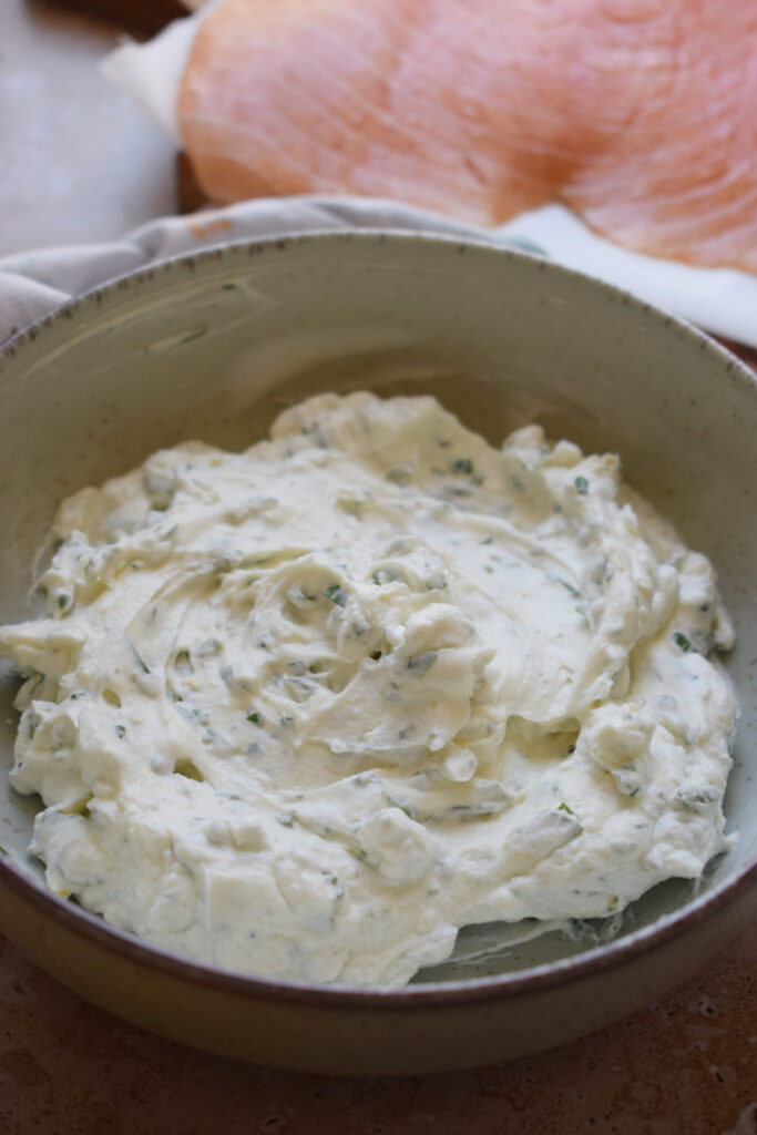 Herb cream cheese in a bowl.
