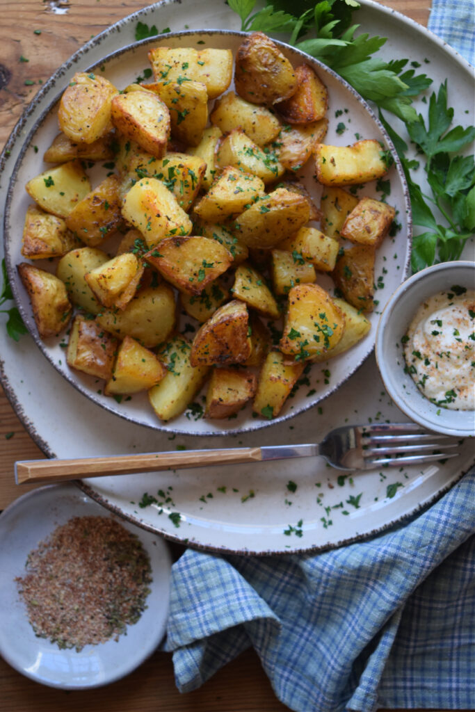 A plate of crispy roasted potatoes.