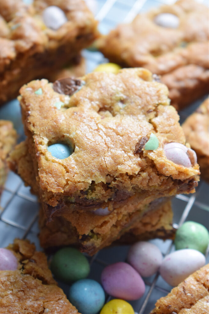 Easter cookie bars in a stack with Easter candy.