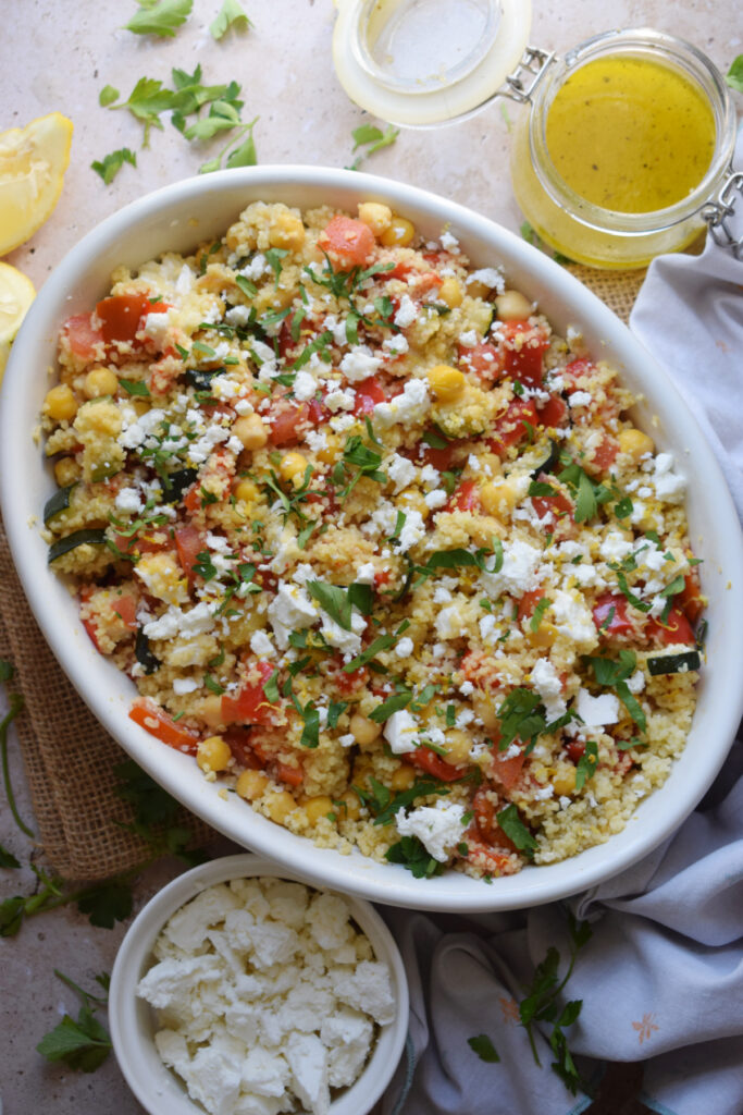 Couscous and chickpea salad in a serving bowl.