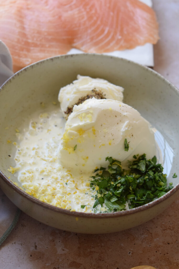 Combine ingredients to make herb cream cheese.