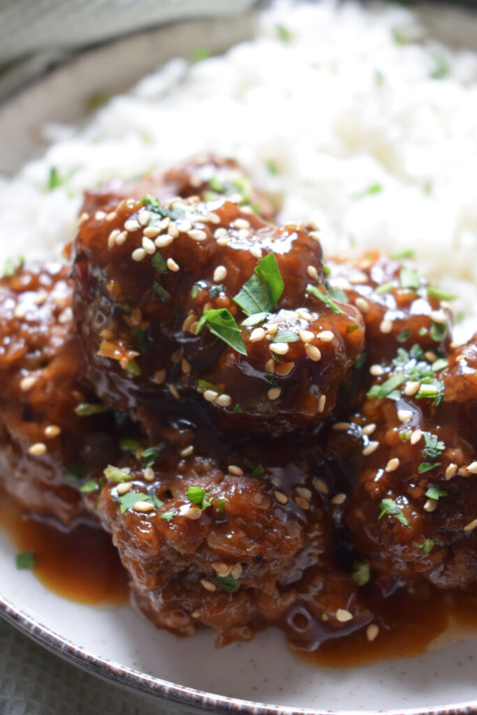 Close up of meatballs with rice.