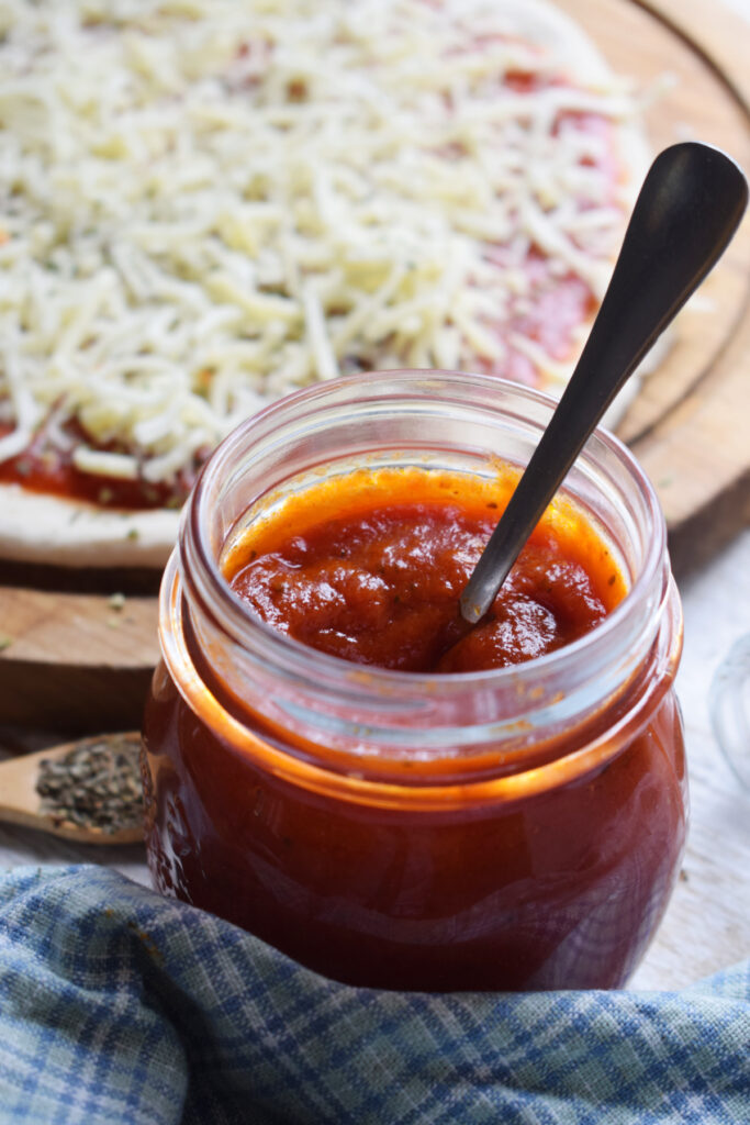 Sauce in a jar with a spoon.