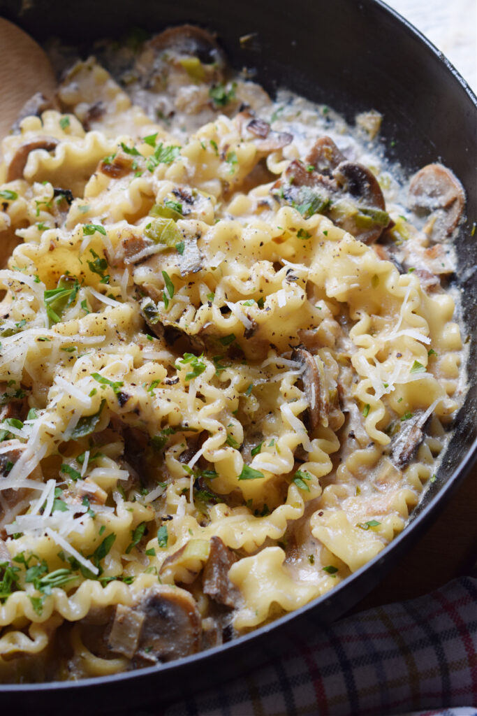Mushroom pasta in a skillet.