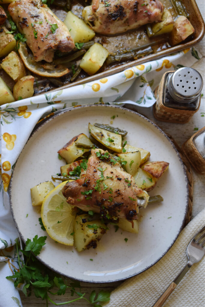 Lemon herb butter chicken on a plate.