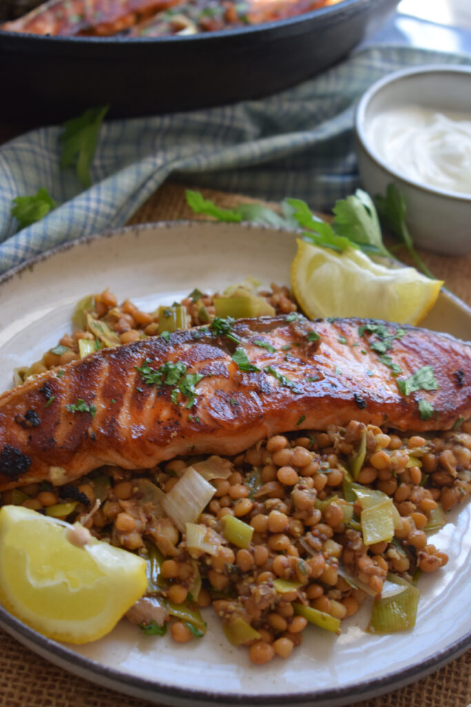 Close up of salmon and lentils on a plate.