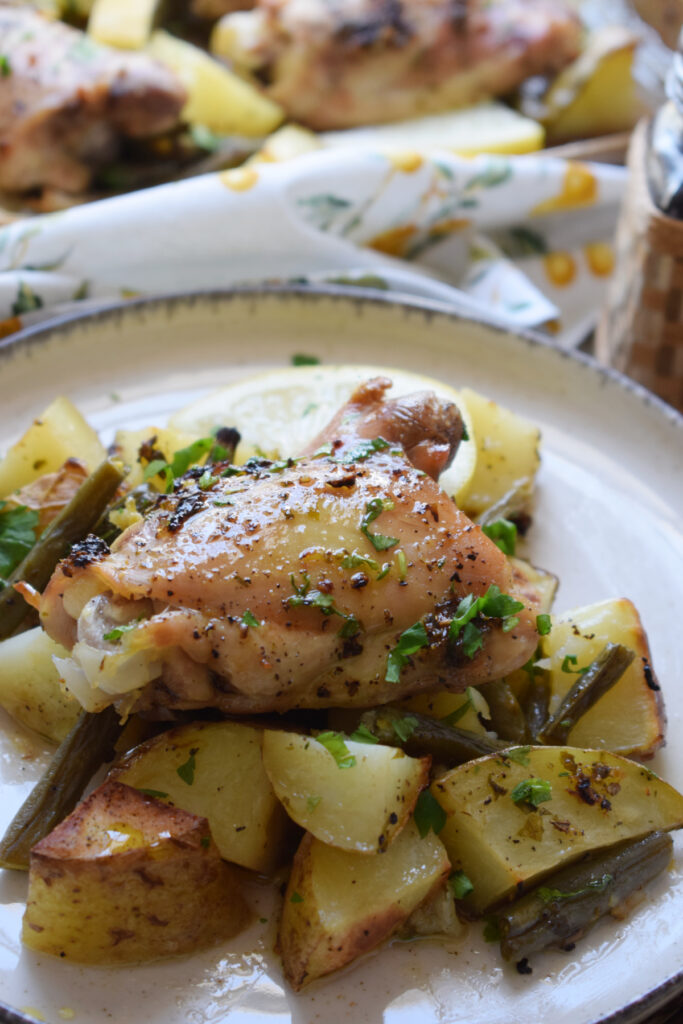 Lemon herb chicken on a plate.