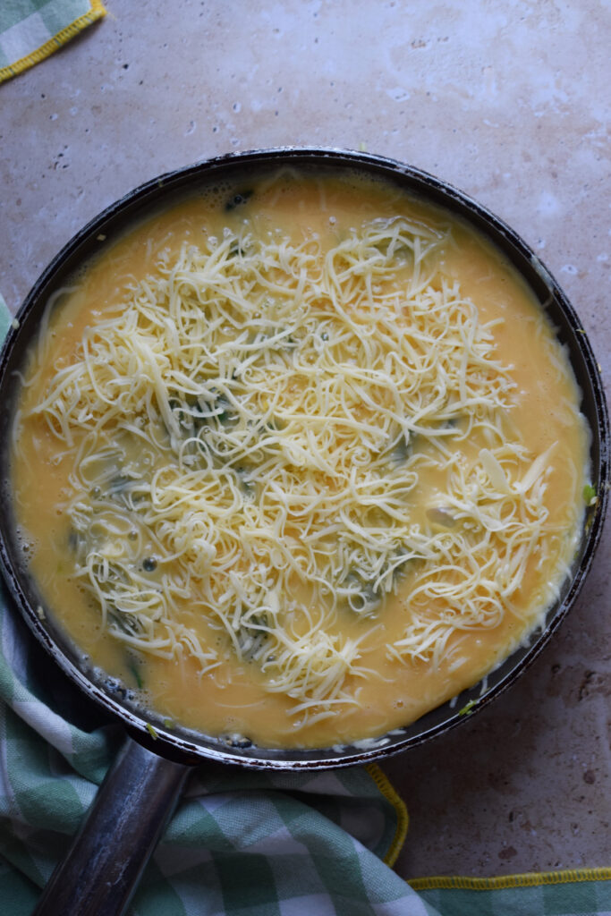 Making a frittata in a skillet.