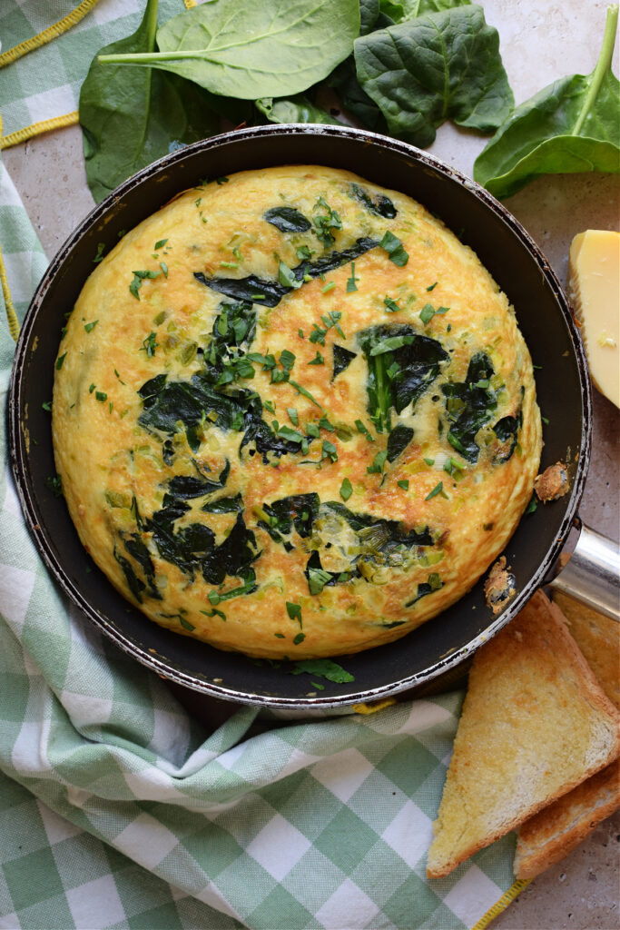 Spinach frittata in a skillet.