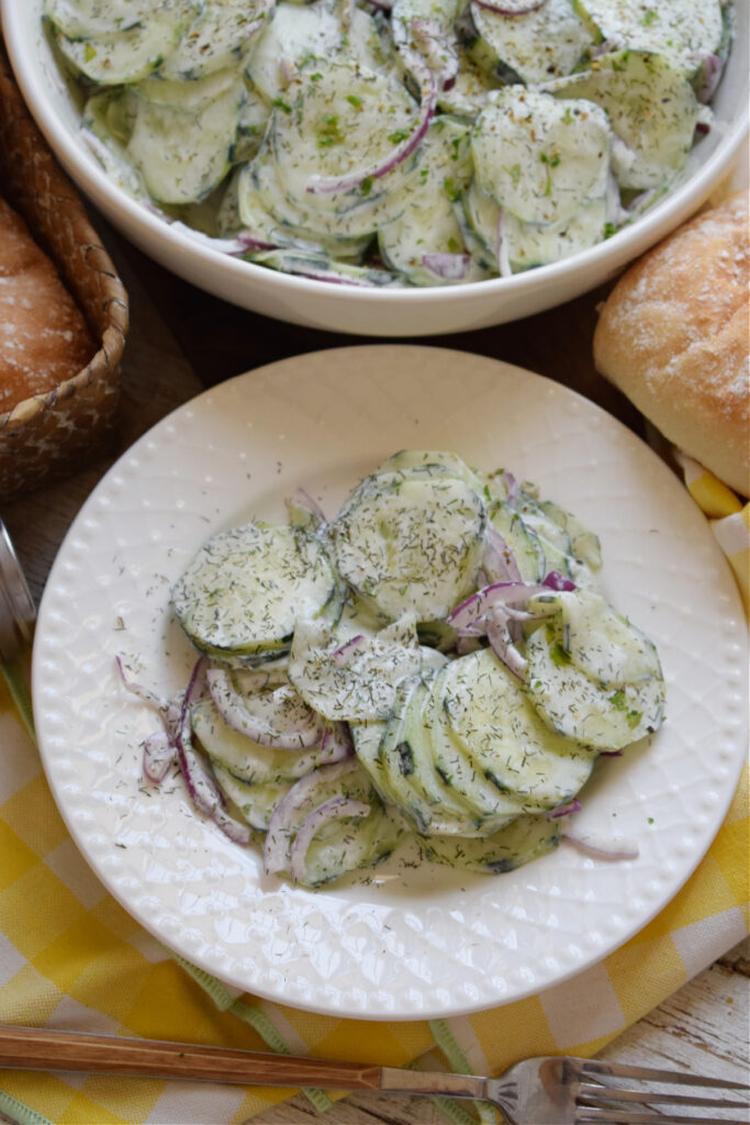 Cucumber salad on a plate with dill.