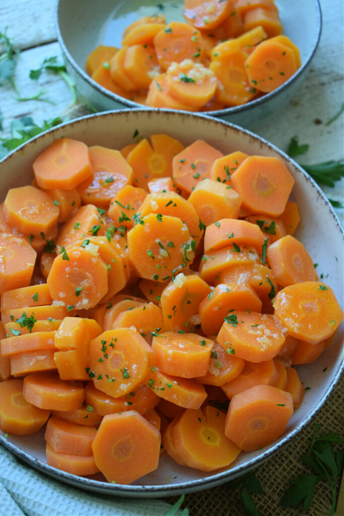 Two bowls of honey garlic butter carrots.